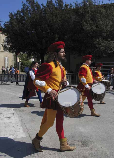 Red and orange drummers at the procession - The Palio of the frog at Fermignano, JBLArts photography
