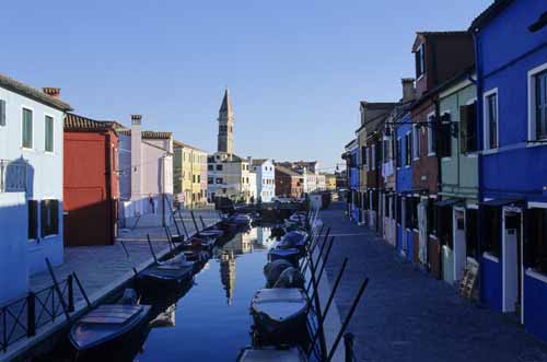 A foreshortened view of a Burano's canal with its coloured houses, boats and bell-tower - Burano in Venice, JBLArts photography