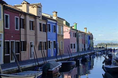A foreshortened view of a Burano's canal with its coloured houses each with its boat - Burano in Venice, JBLArts photography