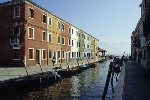A foreshortened view of a Burano's canal with many identical houses which differ only for the colour - Burano in Venice, JBLArts photography