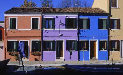 Three terrace houses of different colours: salmon, violet and turquoise - Burano in Venice, JBLArts photography