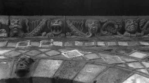 Sculptures on the arches of the cloister: moustached men and monsters - Le Puy En Velay, France, JBLArts photography