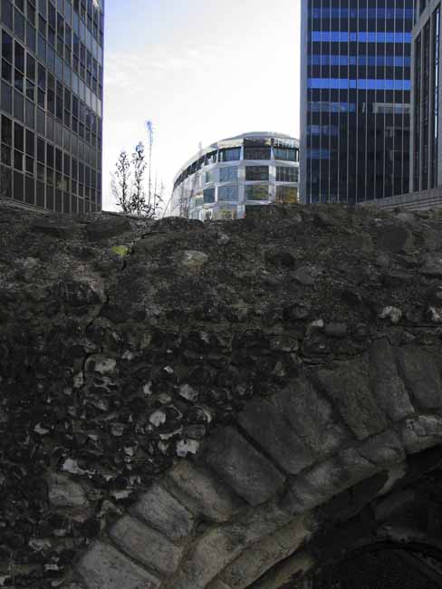 Remains of an old arch on a skyscraper skyline - steel-glass building in London, JBLArts photography